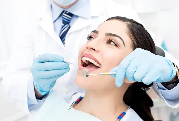 dent depositphotos_67866333-stock-photo-female-patient-receiving-dental-care