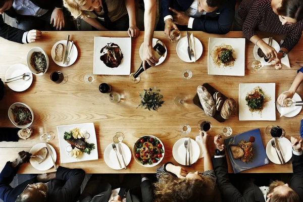 dinner depositphotos_114751052-stock-photo-diverse-people-having-dinner-together