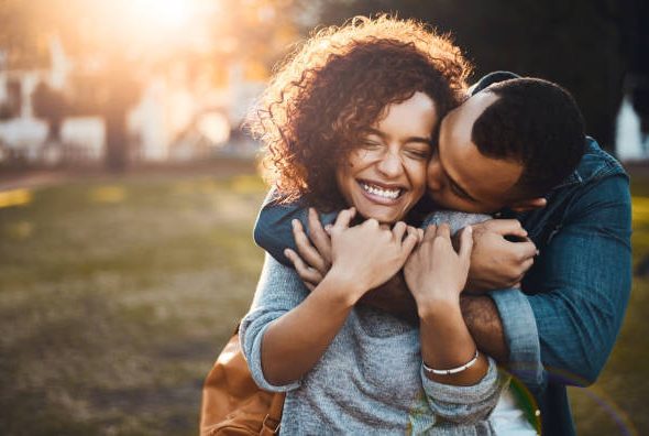 Shot of an affectionate young couple bonding together outdoors