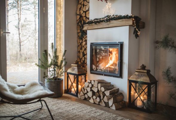 Cozy living room winter interior with fireplace.